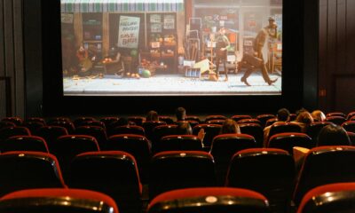 cartoon movie showing on theater screen